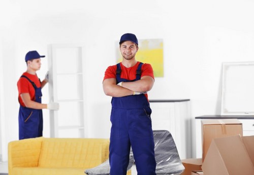 Student removals team handling boxes outside a Streatham terrace house