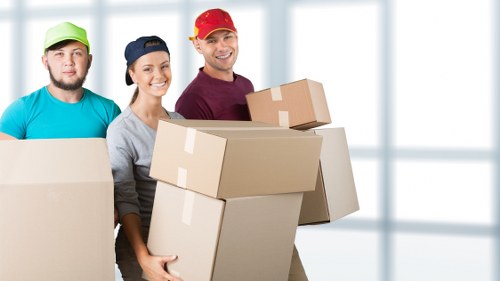 Removal workers handling furniture with care during a Streatham relocation