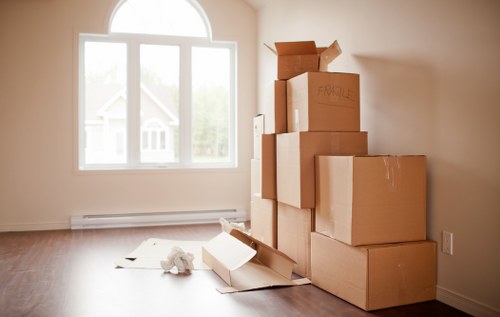 Packed boxes and furniture ready for loading into a removal van