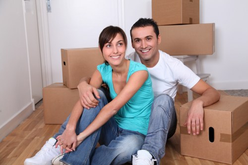 Worker using lifting aids and securing items during a move