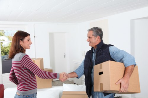 Moving boxes and furniture in a Streatham apartment building