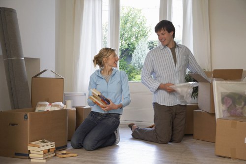 Loading furniture carefully into a removal van with safety awareness