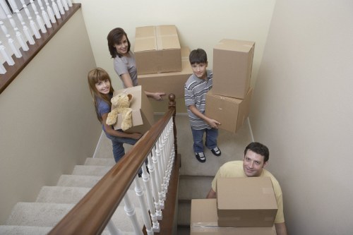 Trained removal staff handling boxes with care